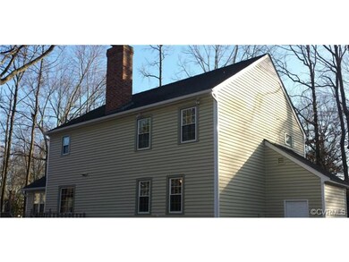 Fresh paint, replacement windows and a storage room can be seen in the rear elevation.