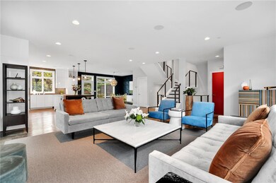 View of living room facing the kitchen and dining