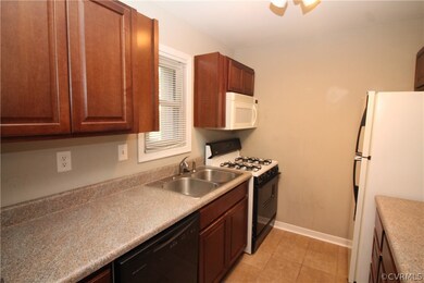 Galley Kitchen with laminate counter tops and gas