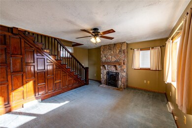 Original wood work and staircase compliment the fl
