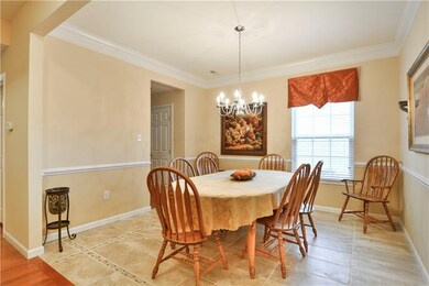 Down the hall from the den is the formal dining ro