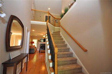 Bright,Open Foyer shows off the upgraded wrought-i