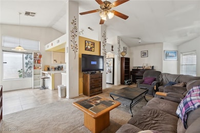 Living room with a ceiling fan, light tile pattern