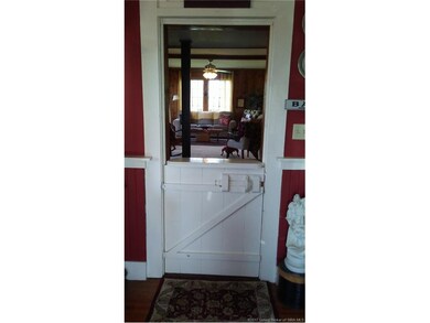 Quaint half door peeks through to living room from