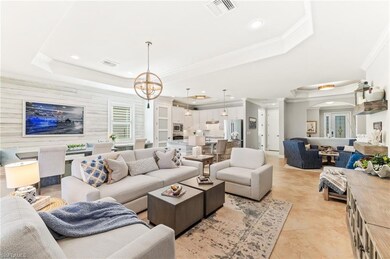 Living area view to entrance with accent wall & sitting area