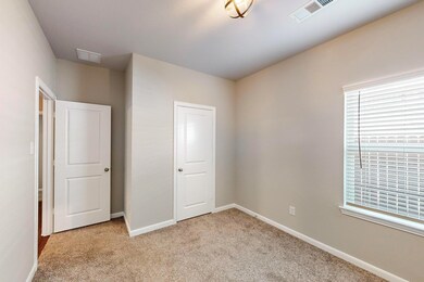 Unfurnished bedroom featuring a closet and light c