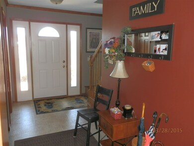 Spacious foyer with walk in coat closet.