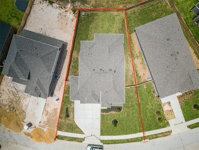 This home sits on a large lot with ample yard space in front and the back, lush landscaping and a well-maintained yard.