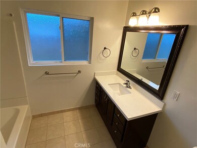 Guest bathroom with bathtub.