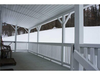 Exterior Back. There is a large covered porch in t