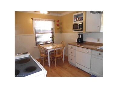 The eat in kitchen has updated counter tops and appliances as well as plenty of cabinet space and a built in dishwasher.