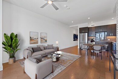 Living room with light wood finished floors, base