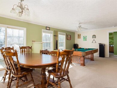Dining area and den/billiards area
