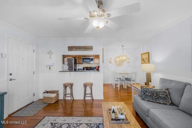 LIVING LOOKING TOWARD KITCHEN AND DINING