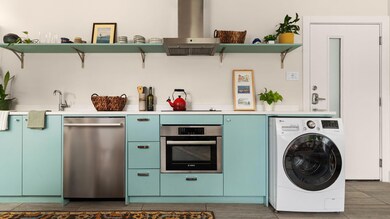 Washroom featuring washer / dryer