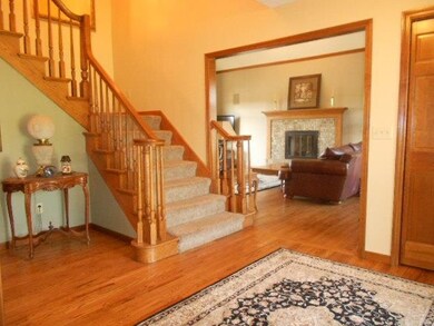 Open 2 story foyer with split staircase, hardwood 