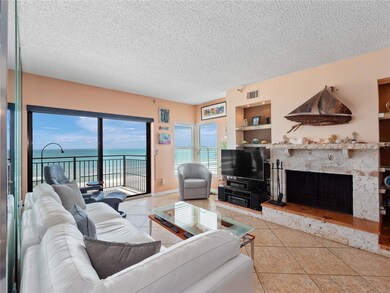 Stone fireplace surround and lighted shelving