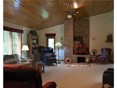 Great Room. High vaulted ceiling with open feel and good daylight windows.  Vermont Castings Wood stove for cozy winter evenings!