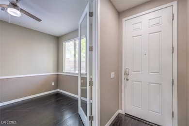 Doorway to outside featuring dark wood-style floor