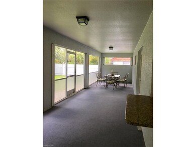 Carpeted screened lanai with pass through bar from the kitchen.  Loads of privacy.