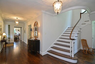 Classic pegged-oak hardwood underscores the entry 