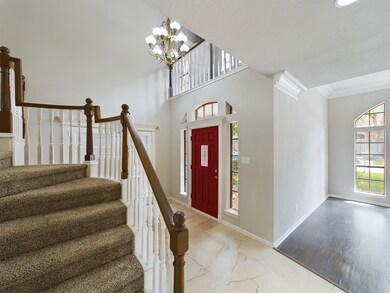 Foyer, Formal Dining & Split Staircase