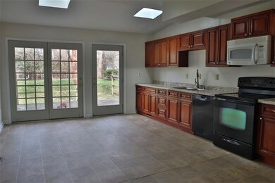 Large kitchen with skylights