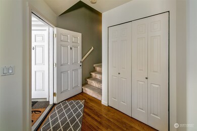 Enter front door to foyer with large coat closet