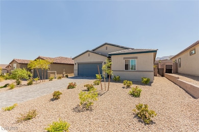 Single story home with decorative driveway, an att