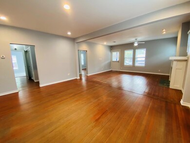 Empty room with dark wood finished floors, recessed lighting, and a ceiling fan