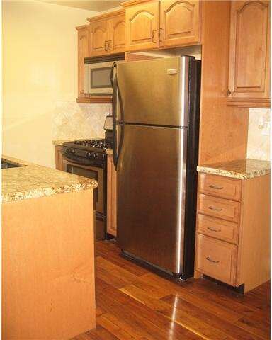 Beveled cainets and drawers to store all your kitc