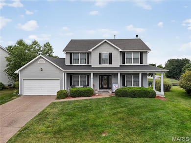 Enjoy your morning coffee on the covered front porch!  The garage has a bump out in back with a workshop area.