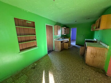 Kitchen featuring a textured ceiling