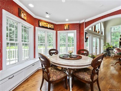 Dining area also has window seats with added stora