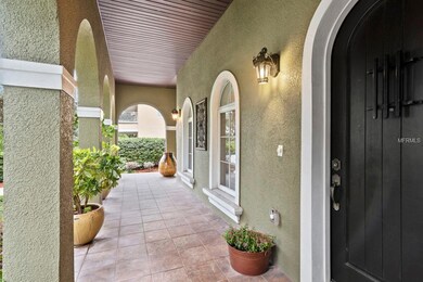 Charming, Arched, Tiled Front Porch