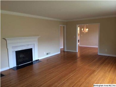 Great wood burning fireplace with marble surround.