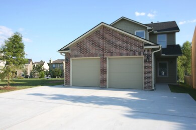 Side A. Garage has automatic opener, and the driveways are extra wide on both sides; rain gutters keep the rain from pouring off the roof on the walkway and porch areas!