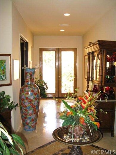 Foyer' entry with etched glass double doors, marbl