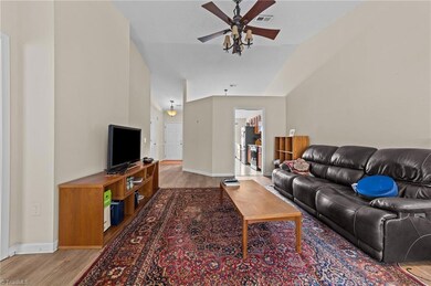 Living room with easy access to the foyer and kitchen.