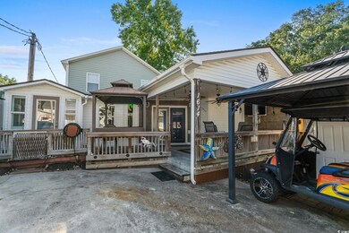 View of front facade with a gazebo and ceiling fan