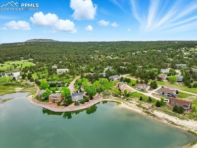 This property is all about Woodmoor Lake and the very best of Monument living!