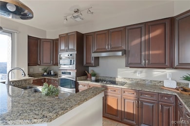 A chefs kitchen with loads of cabinets and counter