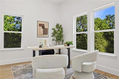 Home office with baseboards and light wood finished floors