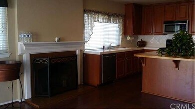 Beautiful kitchen with adjacent fire place and bre