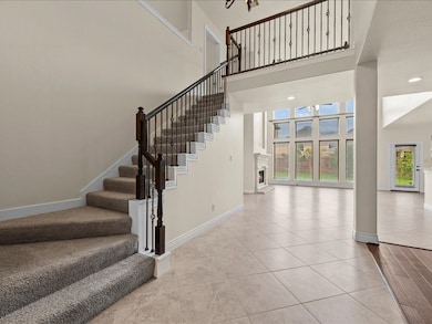 Large and open entry lead you to stairs.