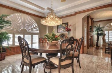 Formal dining room with stunning chandelier.