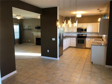 Kitchen, dining room, living room and office are open view.