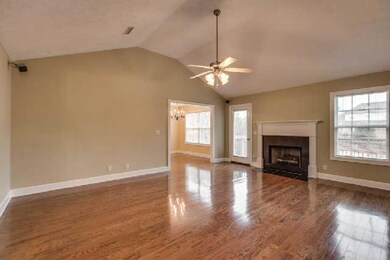 Another view of Great Room with Fireplace and lots of windows
