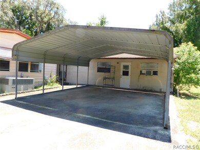 Carport and workshop behind with kitchen