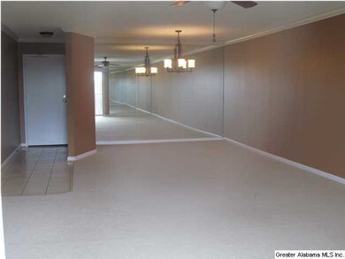 View of front door and dining room area.